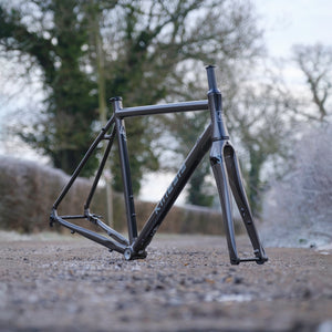 Kinesis 4S Frameset Graphite Grey on a  sunny road