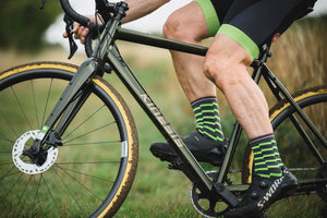 Close up of a GX Race green bike being ridden.