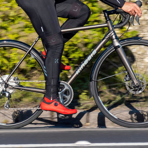 Kinesis 4S Complete Bike Graphite Grey being ridden on a sunny road
