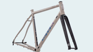A silver Tripster ATR bike frameset with blue and black details, including a fork, displayed against a white background.
