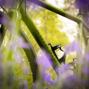 The Kinesis G2 gravel bike in close up in the bluebells