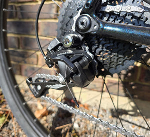 Close-up of a bicycle gear system with 'microSHIFT' branding.