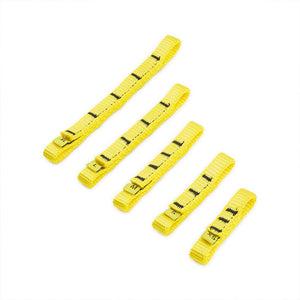 Five Wholegrain Cycles yellow Load straps of varying widths and lengths, arranged diagonally on a plain white background. Each strap features black printed measurement markings and a metal buckle at one end.