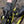 Person wearing black mamba gloves adjusting a bicycle chain 