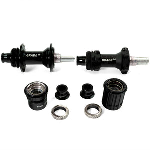 Boyd Cycling 36mm road wheel grade 54 front and rear hubs with freehubs and axle caps on a white background