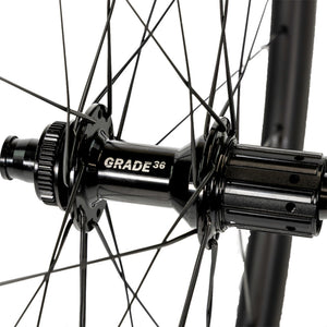 Close up of a Boyd Cycling 44mm Carbon Road Wheel Grade 36 rear wheel hub and spokes on a white background