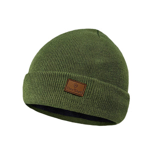 An Dexshell Watch Beanie in Pea Green on a white background with a brown faux-leather brand patch on the front cuff, shown against a plain white background.
