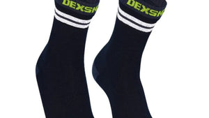 Dexshell black socks with white stripes and green accents on a white background