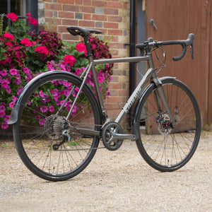 Kinesis 4S Tiagra Road Bike - Graphite Grey three quarter rear 