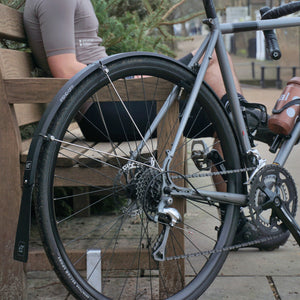 Fend Off mudguard on a bike next to a bench