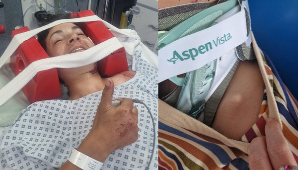 Fran in a hospital gown with a bandage on their head, next to a seat with an Aspen Vista sign.