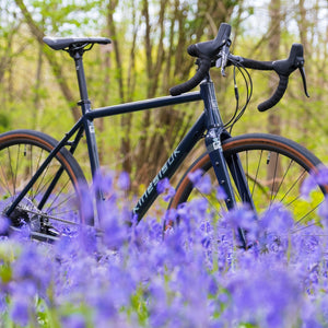 Kinesis G2 Midnight Blue Complete Bike in a Field of Bluebells