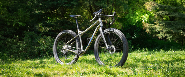 MTN bike on grass with trees in the background