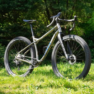 Frenweh bicycle on grass with greenery in the background