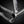 Close-up of a titanium bike frame with a label on a black background