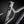 Close-up of a bicycle frame with a brand logo on a dark background