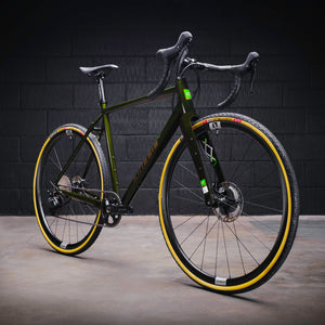 Kinesis GX Frameset in green taken in a warehouse, three quarter view.