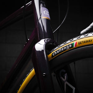 Kinesis GX Frameset in purple taken in a warehouse, head tube.