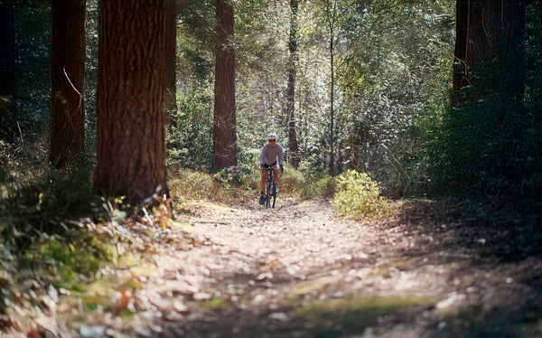 Kinesis Tripster AT ridden by Fran in the woods