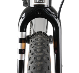 Close-up of a Kinesis Tripster AT fork with a black tire on a white background