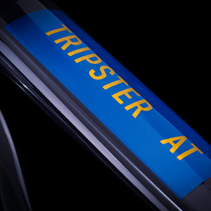 Kinesis Tripster At logo on a midnight blue frame top tube.