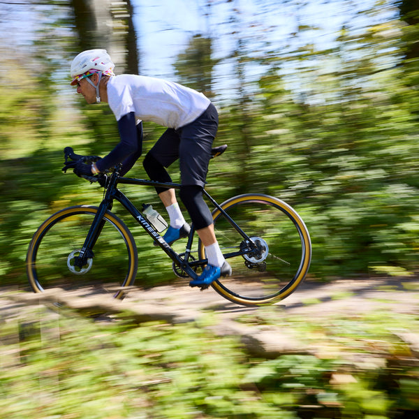 Tripster AT Plus being ridden through the woods at speed.