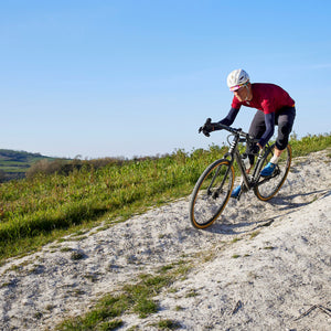 Kinesis Tripster AT being ridden down a dusty trail.