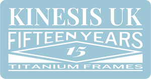 A light blue rectangular graphic with white text reading 'KINESIS UK', 'FIFTEEN YEARS', '15', and 'TITANIUM FRAMES'.