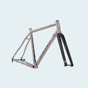 A silver Tripster ATR bike frameset with blue and black details, including a fork, displayed against a white background.