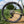 Close-up of a bicycle wheel with 'Challenge Gravine' tires on a natural background