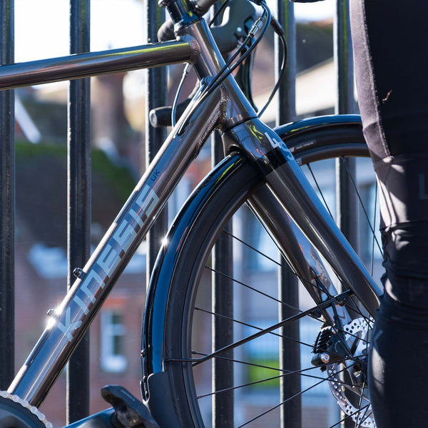 Kinesis 4S Shimano Tiagra road bike close up next to railings.