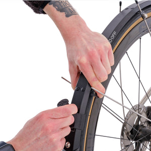 Fend Off wide rear light mount being fitted on a bike.