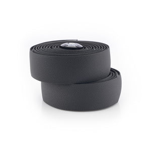 Two coiled black textured Kinesis 4 Seasons 2.5mm bicycle handlebar tape rolls stacked on a white background.