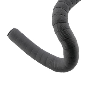 A curved dark gray bicycle handlebar tape wrap with a textured, ribbed grip pattern, shown against a solid white background.