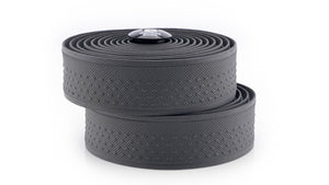 Two rolls of textured bicycle tape in dark gray, stacked on a clean white background.