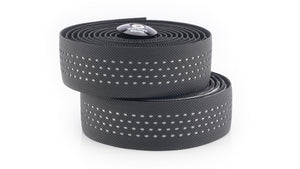 Two coiled black Kinesis Reflective bicycle handlebar tape with reflective dotted lines, stacked on a white background.