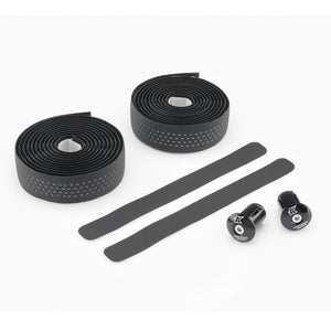 Black Kinesis 4 Seasons Reflective 3.5mm bicycle handlebar tape set with two rolled sections of grip tape, two long adhesive strips, and two black hardware knobs on a white background.