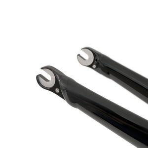 Close-up of two black Kinesis bicycle AF fork ends with silver metal cleats, shown on a clean white background.