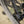 Close-up of a Kinesis Fernweh Mountain bicycle tyre with the brand name 'REYNOLDS' visible on the wheel rim, photographed outdoors with sandy ground and blurred wheel spokes in the background.