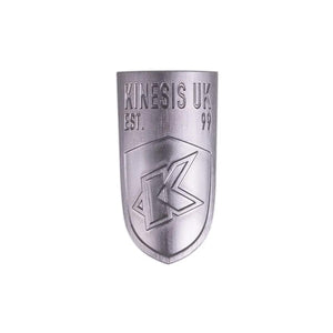 A silver aluminium head badge with the Kinesis UK logo for bicycles