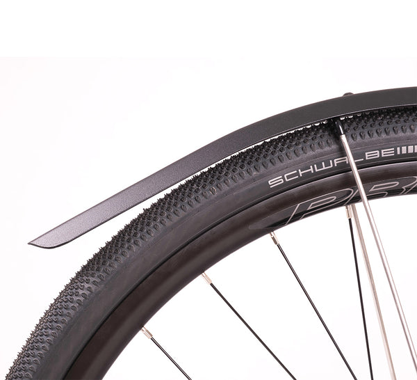 A black bicycle mudguard attached to a wheel, with anodised aluminium construction and laser graphics.