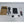 Charger kit with box, cable, key, and other accessories on a white surface