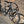 Black bicycle leaning against a brick wall