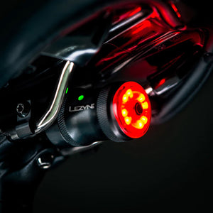Lezyne Saddle Drive 250 rear light on in position on a bike saddle.