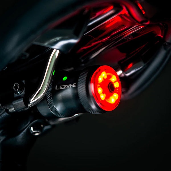 Lezyne Saddle Drive 250 rear light on in position on a bike saddle.