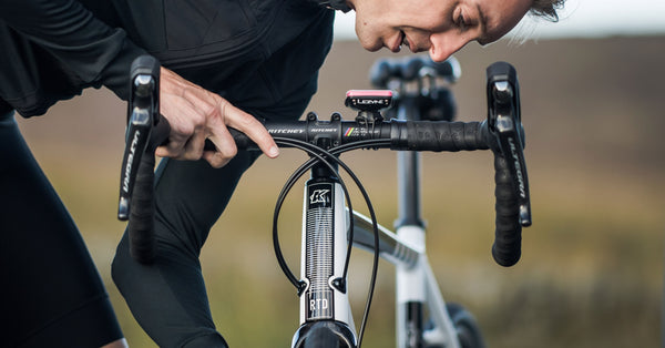 Rider working on his bike banner used on the product registration page.
