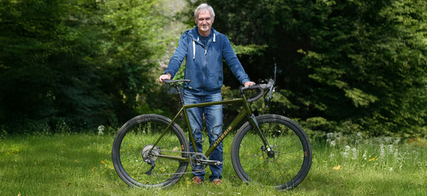 Scott Purchase with his GX Race bike outside the Upgrade HQ on the grassy section