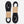 Two Wholegrain Cycles black and white bungees with white speckled braided cords and black plastic jump rings, each wrapped with a brown kraft paper band, on a light grey background.