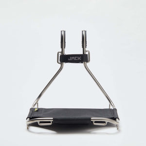 A Wholegrain Cycles Jack Classic bike rack with a black fabric seat and silver metal frame, shown against a plain white studio background.