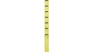 A long, narrow Wholegrain Cycles yellow and black load strap with a black label near the top, photographed vertically against a plain white background.